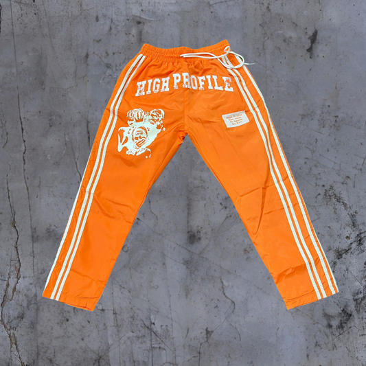 See No Evil Windbreaker Pants — cream/orange